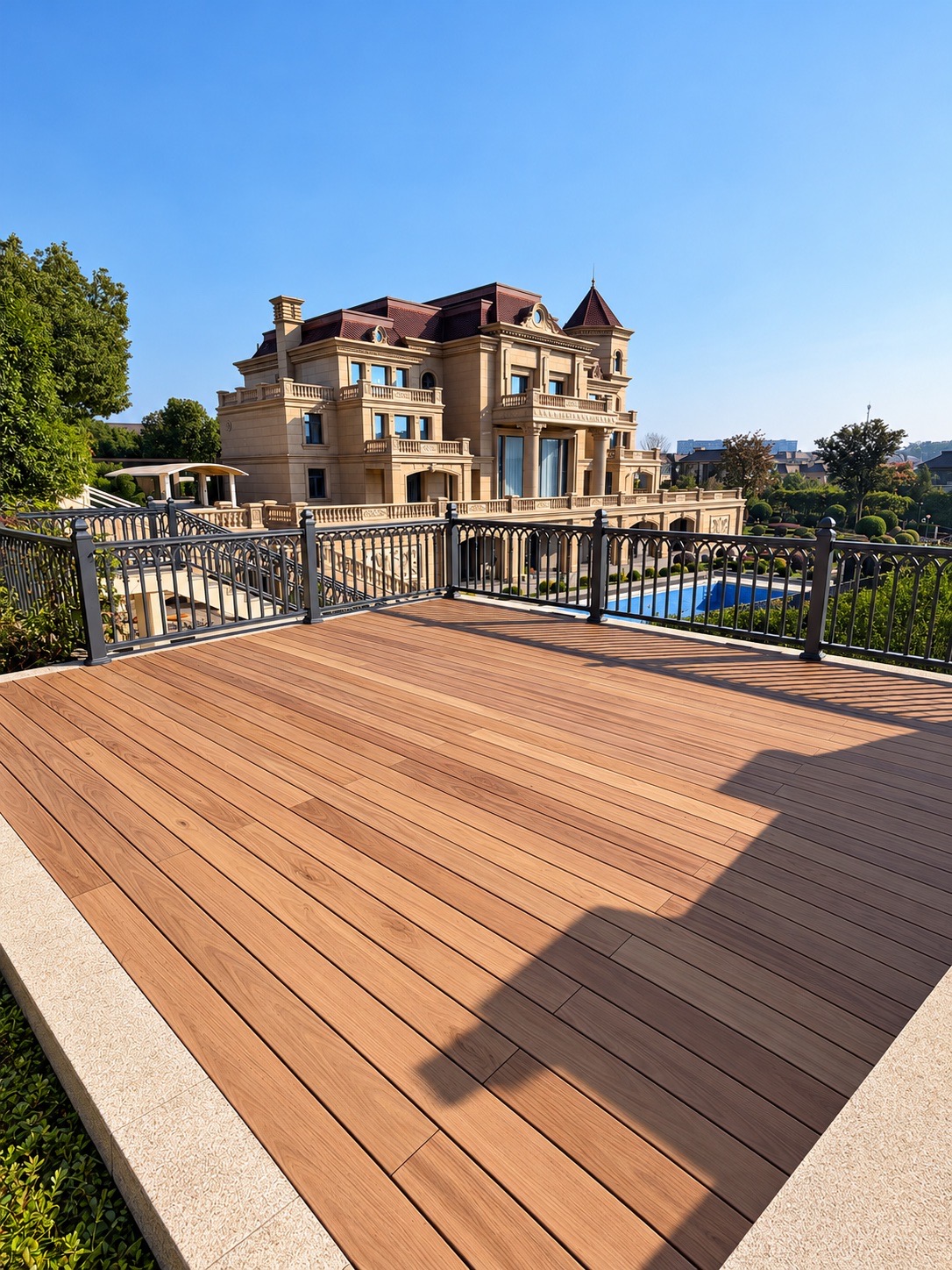 Open roof terrace with PMMA film decking and landscaped villa view